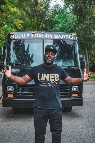 Antwain "Kuts" Booker outside of New Element Barber's Luxury Mobile Barber Shop